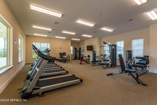 workout area with a textured ceiling