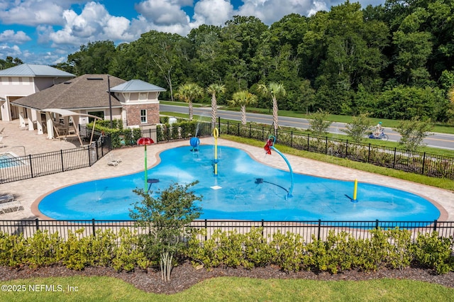 view of swimming pool featuring a patio area