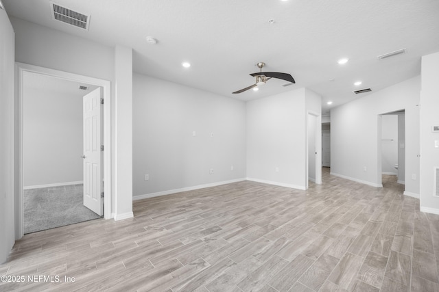 unfurnished room with ceiling fan and light hardwood / wood-style floors