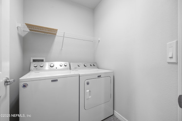 laundry room featuring separate washer and dryer