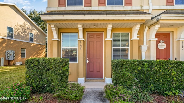 property entrance with covered porch