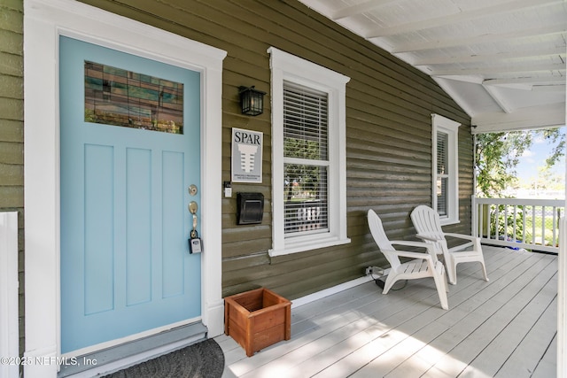 doorway to property with a porch