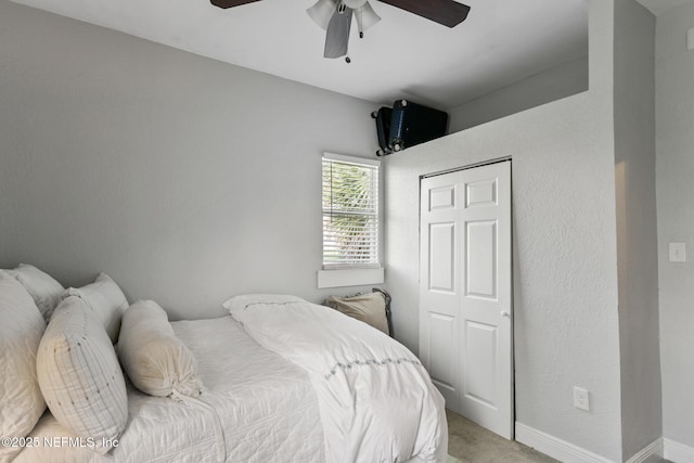 bedroom with carpet floors, a closet, and ceiling fan