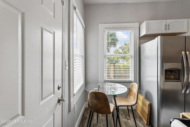 dining space featuring dark hardwood / wood-style floors