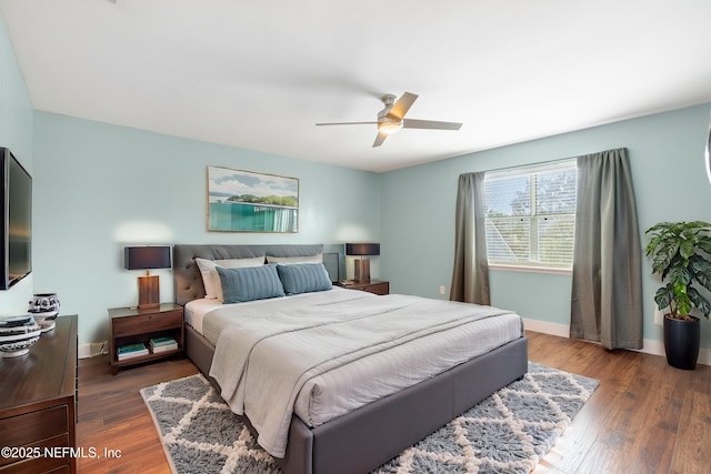 bedroom featuring ceiling fan and dark hardwood / wood-style flooring