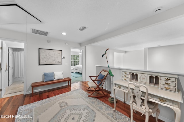 interior space featuring beamed ceiling and wood-type flooring