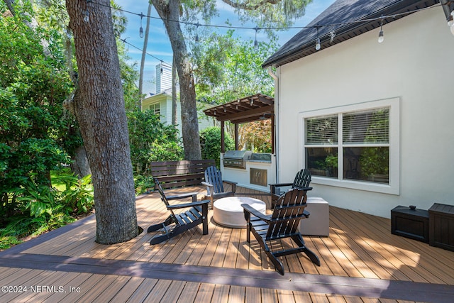 wooden terrace featuring grilling area and area for grilling