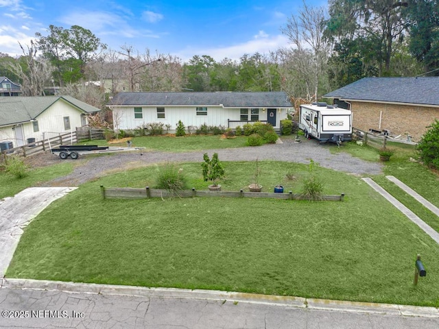 single story home featuring a front yard