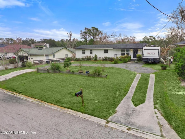 ranch-style home with a front yard