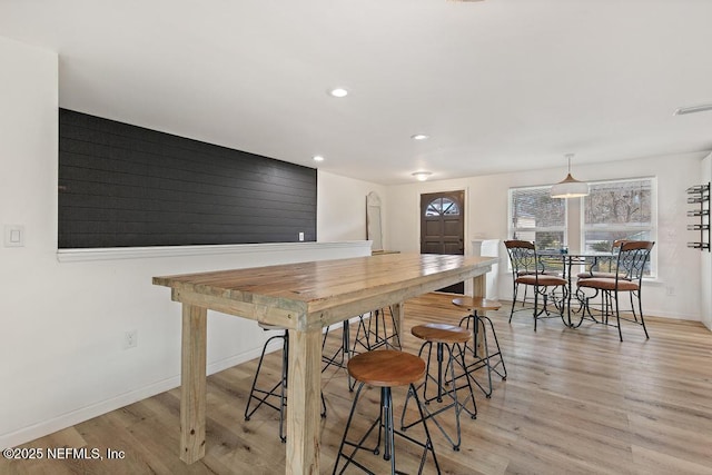 dining space with light wood-type flooring