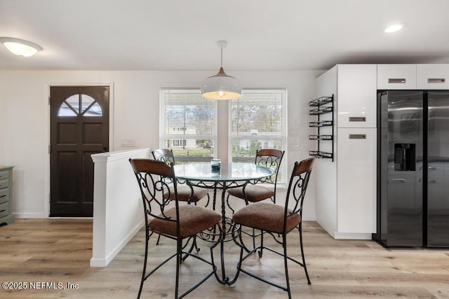 dining room featuring light wood-type flooring