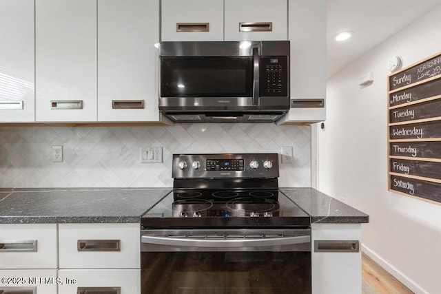 kitchen with white cabinetry, light hardwood / wood-style flooring, range with electric stovetop, and tasteful backsplash