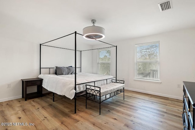 bedroom with light wood-type flooring