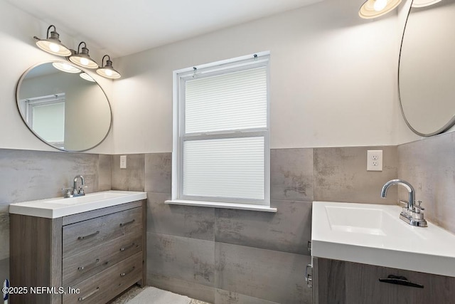 bathroom featuring decorative backsplash, vanity, and tile walls