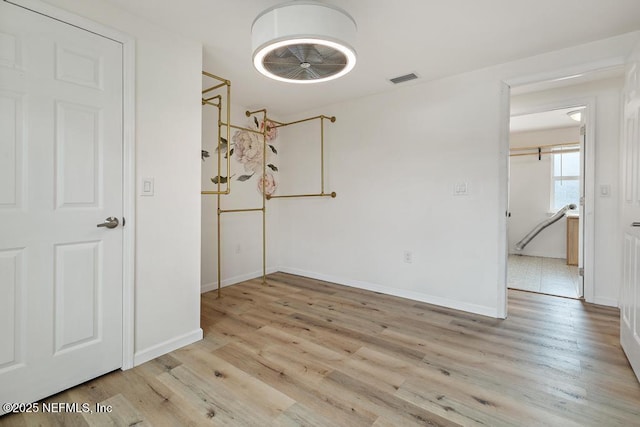 spare room featuring light hardwood / wood-style floors