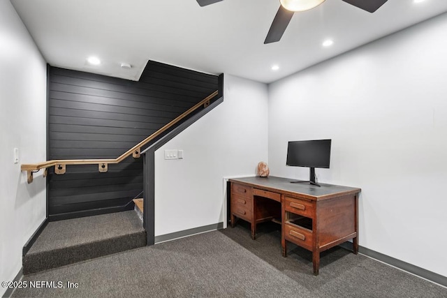 office area with ceiling fan and dark colored carpet