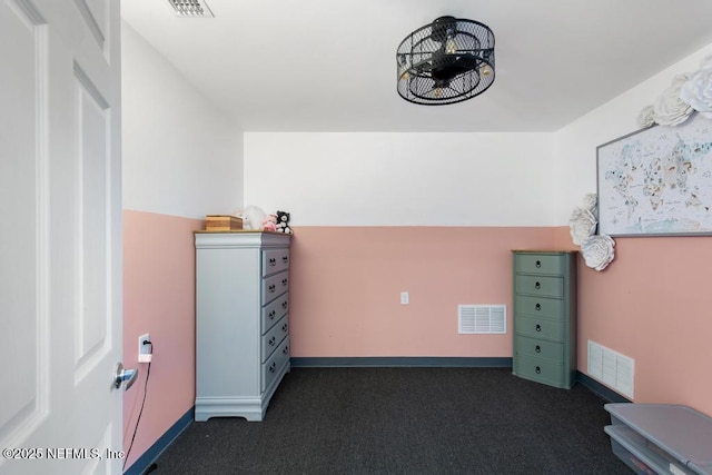 unfurnished bedroom featuring dark carpet