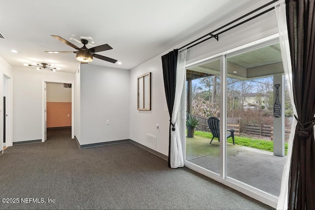 carpeted empty room featuring ceiling fan