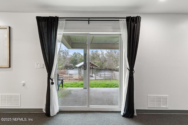 doorway to outside featuring a water view