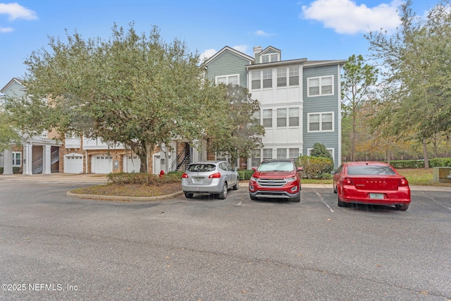 8550 Touchton Rd Unit 127, Jacksonville, FL 32216 - view of front facade with stairway and uncovered parking