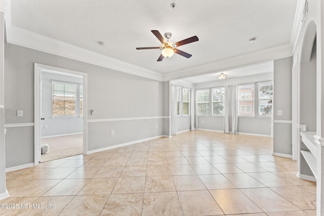 8550 Touchton Rd Unit 127, Jacksonville, FL 32216 - empty room with ornamental molding, plenty of natural light, a ceiling fan, and a textured ceiling