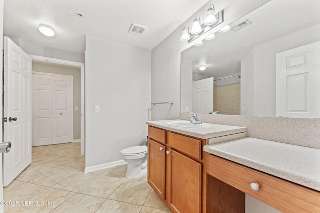 8550 Touchton Rd Unit 127, Jacksonville, FL 32216 - bathroom with vanity, a textured ceiling, and a shower with door