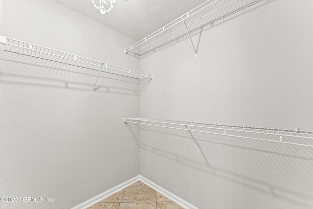 8550 Touchton Rd Unit 127, Jacksonville, FL 32216 - spacious closet with light tile patterned floors