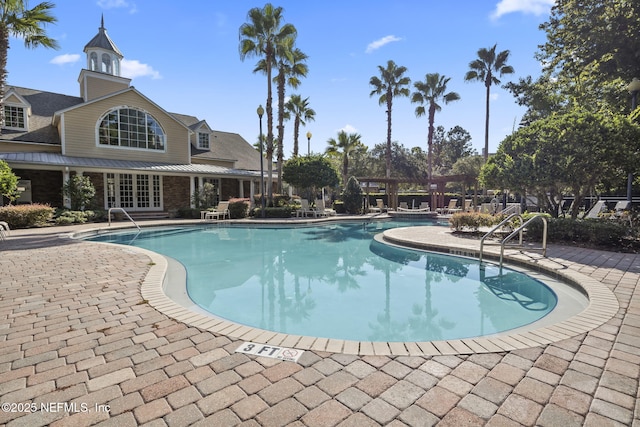 8550 Touchton Rd Unit 127, Jacksonville, FL 32216 - community pool featuring a patio area and french doors