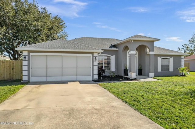 view of front facade with a front yard and a garage