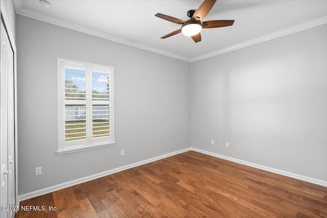 unfurnished room featuring hardwood / wood-style flooring, plenty of natural light, ceiling fan, and ornamental molding