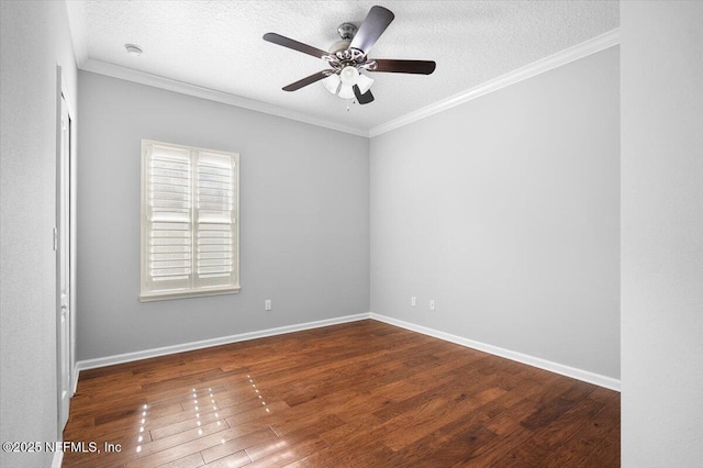 empty room featuring ceiling fan, crown molding, dark wood-type flooring, and a textured ceiling