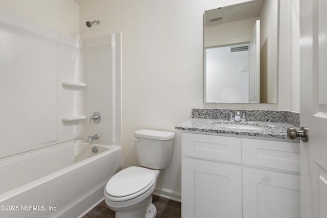 750 Hunter Rd, Palatka, FL 32177 - bathroom with visible vents, toilet,  shower combination, vanity, and wood finished floors