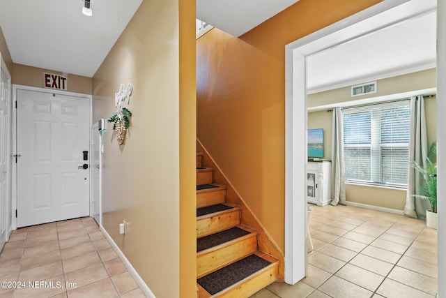 14 Ballard Ave, Saint Augustine, FL 32084 - entryway with light tile patterned floors and stairway