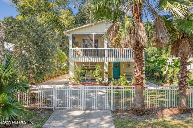 14 Ballard Ave, Saint Augustine, FL 32084 - view of front of house featuring a fenced front yard, a gate, and a sunroom