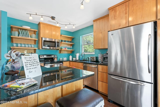 14 Ballard Ave, Saint Augustine, FL 32084 - kitchen featuring appliances with stainless steel finishes, open shelves, dark stone countertops, and dark wood-type flooring