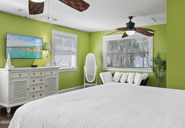 14 Ballard Ave, Saint Augustine, FL 32084 - bedroom featuring multiple windows, dark wood-style floors, and ceiling fan