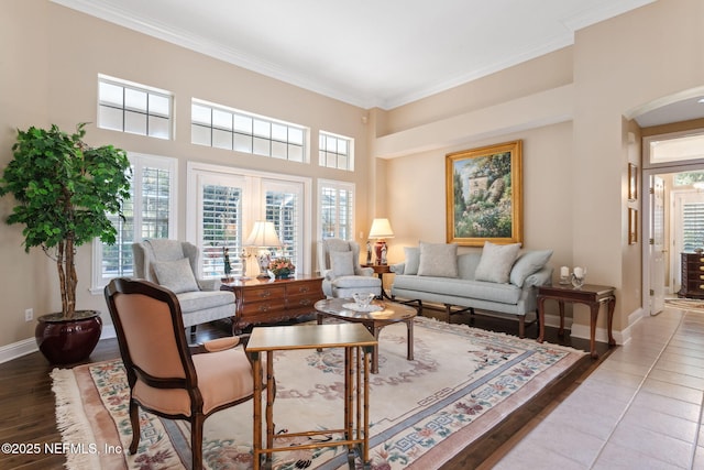 tiled living room featuring ornamental molding