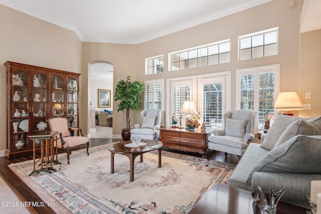 interior space with hardwood / wood-style floors and crown molding