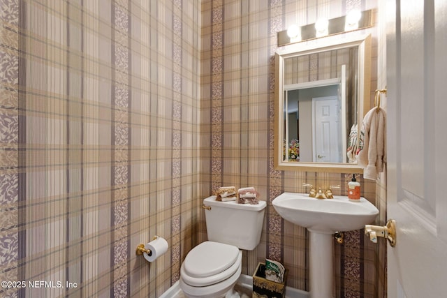 bathroom featuring sink and toilet