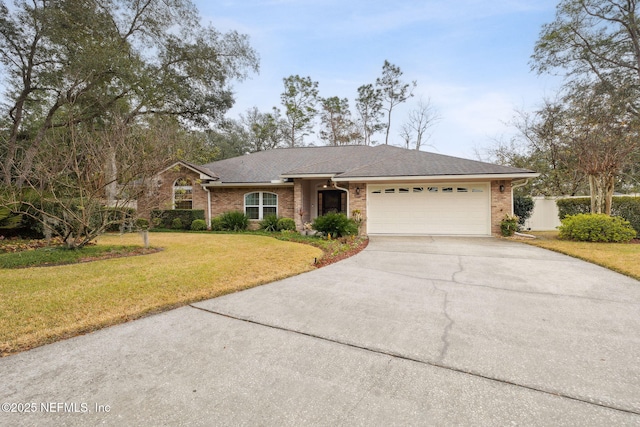 ranch-style home with a front yard and a garage