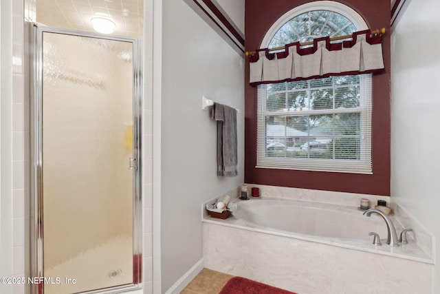 bathroom featuring separate shower and tub