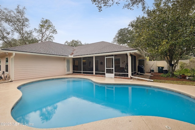 view of pool with a sunroom