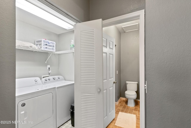 laundry area with washing machine and dryer