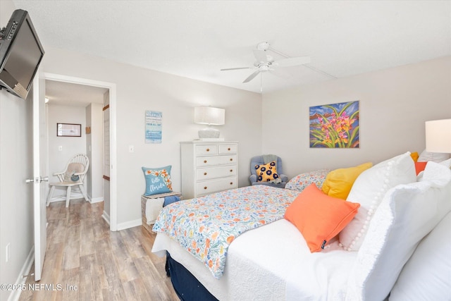 bedroom featuring ceiling fan and light hardwood / wood-style floors