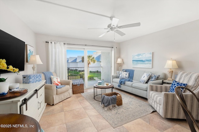 living room featuring light tile patterned floors and ceiling fan