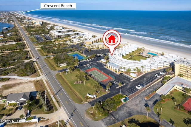 bird's eye view with a water view and a view of the beach