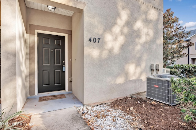 entrance to property with central AC unit