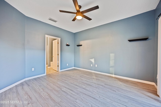 unfurnished room with light hardwood / wood-style flooring and ceiling fan