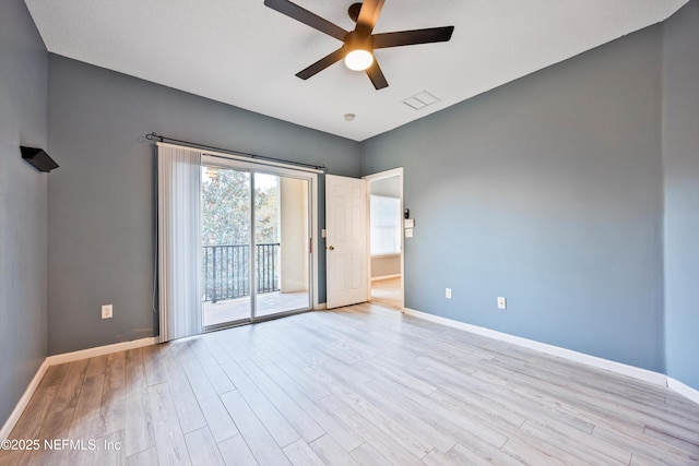 empty room featuring ceiling fan and light wood-type flooring