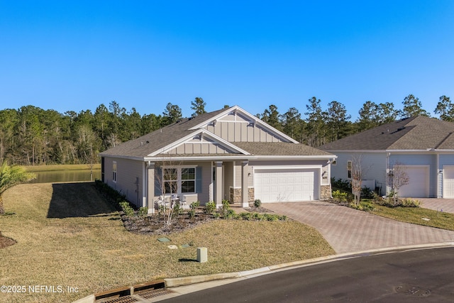 view of front facade with a garage and a front lawn